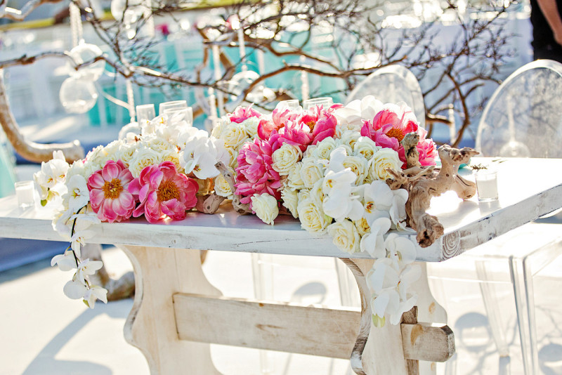 Coral peonies, white roses, white phalaenopsis orchids, manzanita branches, aqua blue linens, outdoor weddings mexico