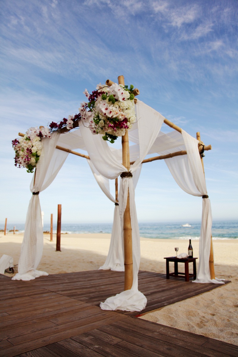 white draped wedding ceremony arch beach weddings wooden floors los cabos