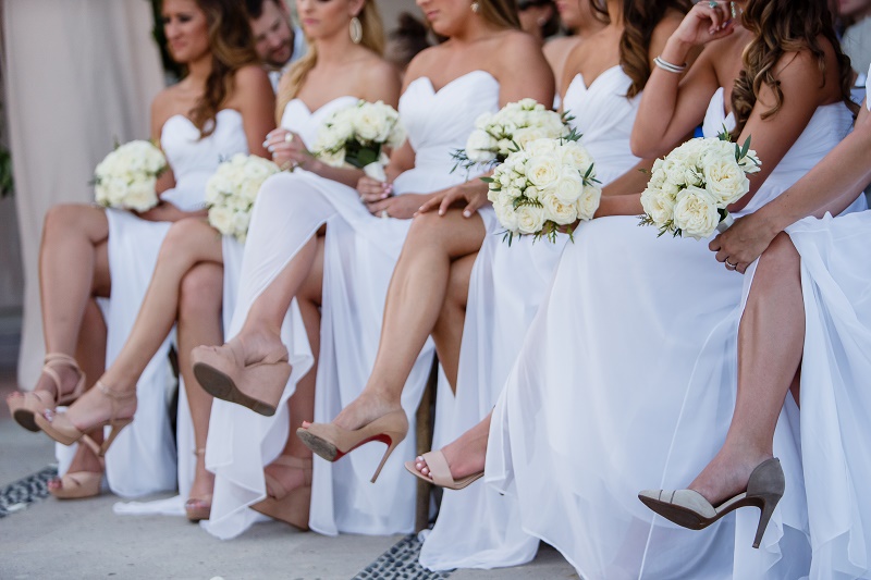 bridesmaids shoes seated during wedding ceremony white bouquets elena damy