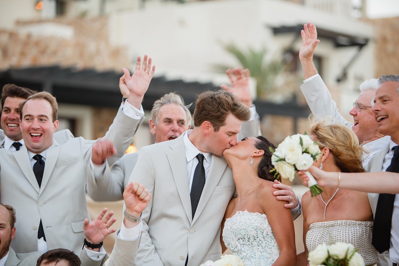 bride and groom kiss beach weddings mexico destination wedding planners elena damy
