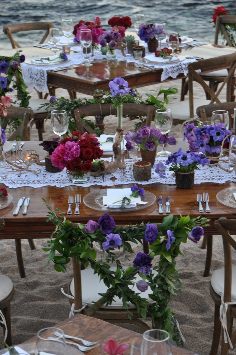 red and purple flowers beach weddings mexico elena damy floral design los cabos wooden tables lace linens 16