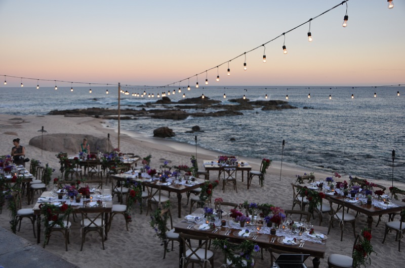 red and purple flowers beach weddings mexico elena damy floral design los cabos wooden tables lace linens 9
