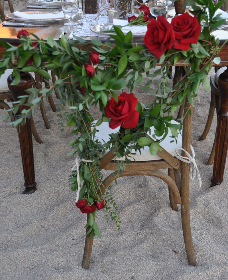 red and purple flowers beach weddings mexico elena damy floral design los cabos wooden tables lace linens red rose chairs 2