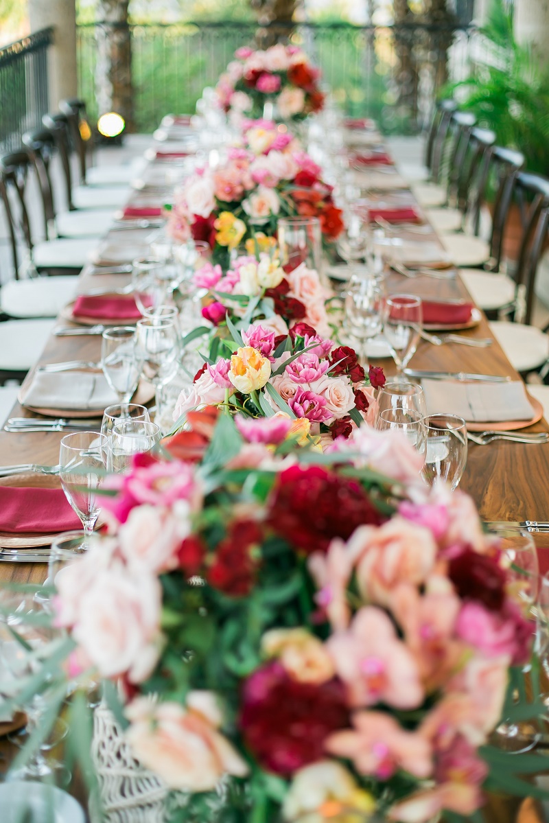 long wedding tables red and pink flowers elena damy event design cabo