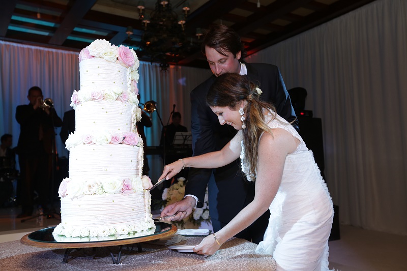 cake cutting Cabo Weddings One and Only Palmilla Elena Damy Event Design Cabo Chris Plus Lynn Photo