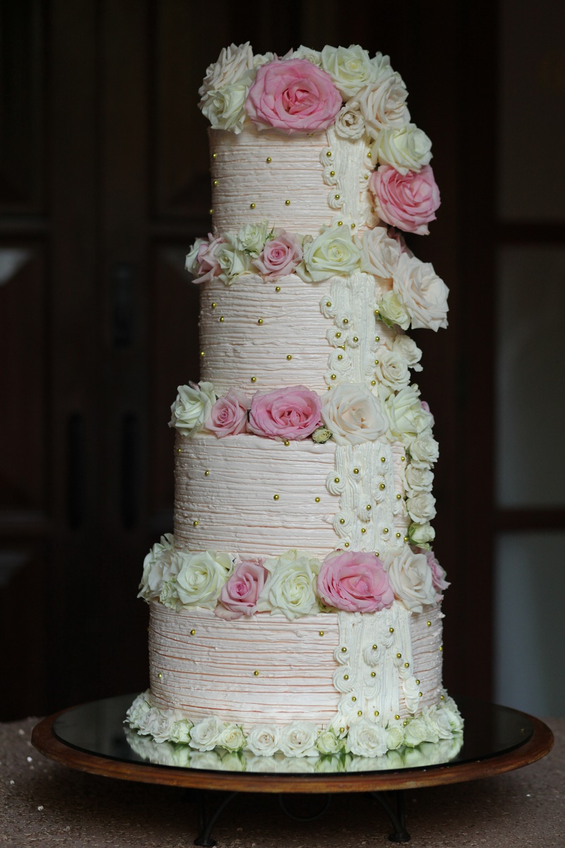four tier stacked wedding cake Cabo Weddings One and Only Palmilla Elena Damy Event Design Cabo Chris Plus Lynn Photo