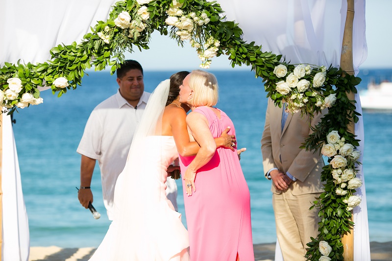 white drape and floral chuppah beach wedding cabo san lucas mexico destination weddings elena damy floral design