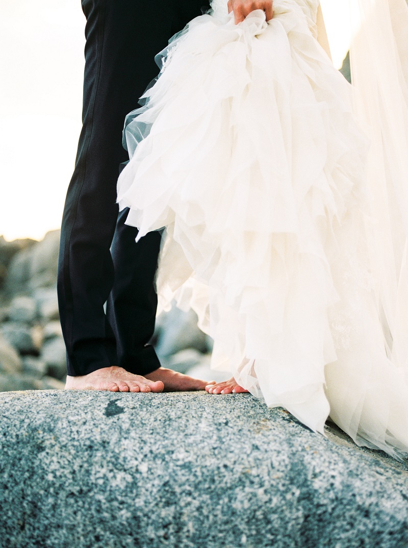 barefoot-bride-and-groom-on-the-rocks-cabo-san-lucas-weddings-elena-damy-destination-wedding-planners