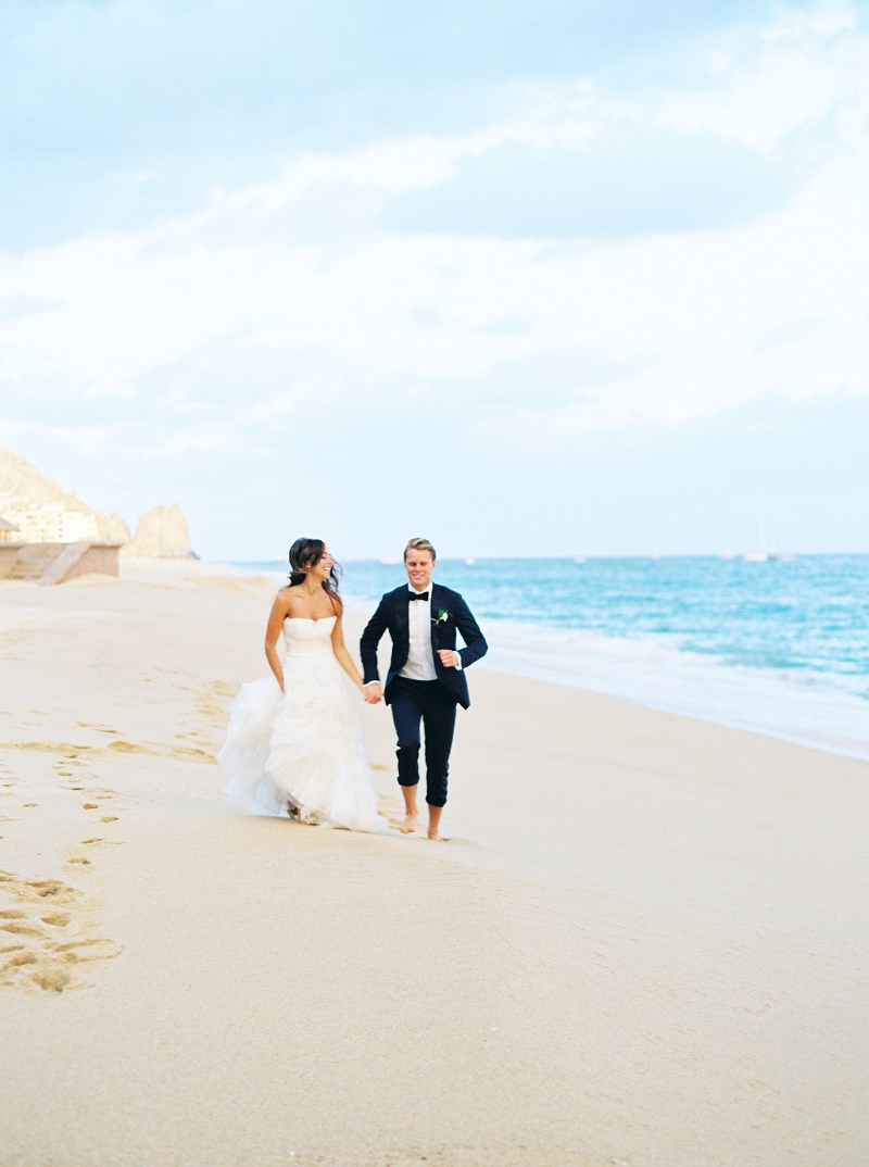 bride-and-groom-running-on-the-beach-mexico-weddings-elena-damy-destination-wedding-planner-los-cabos